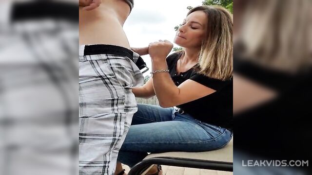 Sugar mom sucking her young lover in park - 1 image