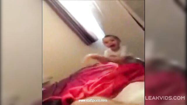 Little kid plays with mom's dildo