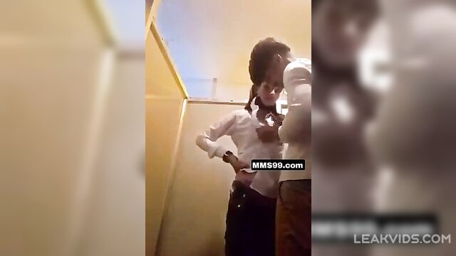 Pretty college girl with her boyfriend inside school washroom - 1 image