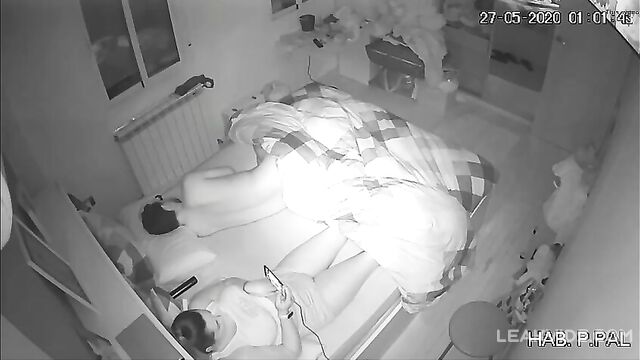 Real mother and son in the same bed, hidden camera caught her masturbating while he sleeps - 1 image