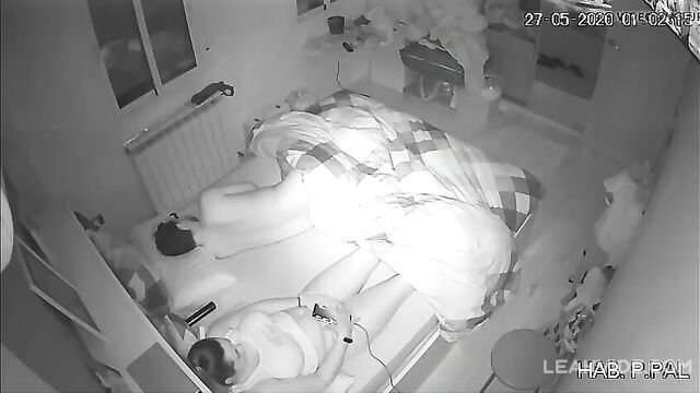 Real mother and son in the same bed, hidden camera caught her masturbating while he sleeps