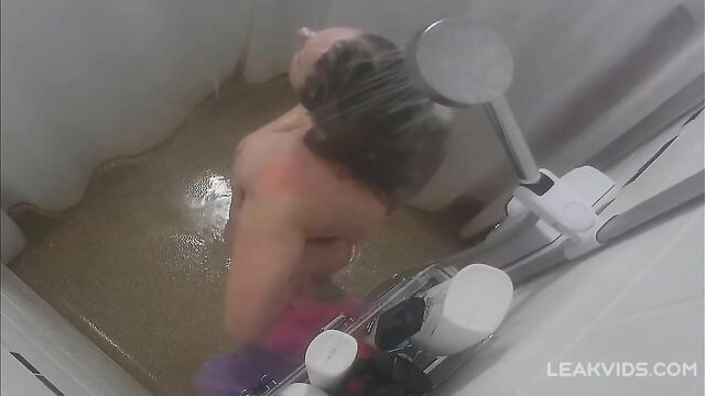 Son installed a hidden camera in the shower and watches his mother what a slut she is