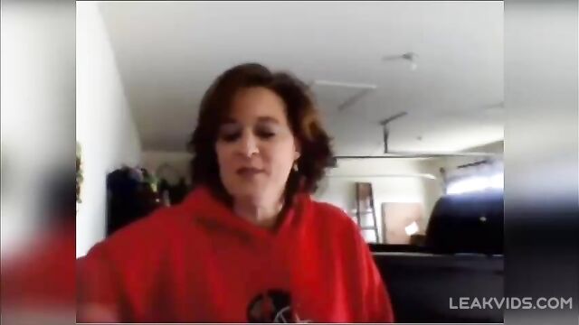 Redheaded mommy shows big bouncy boobs on camera to her daughter's boyfriend - 1 image