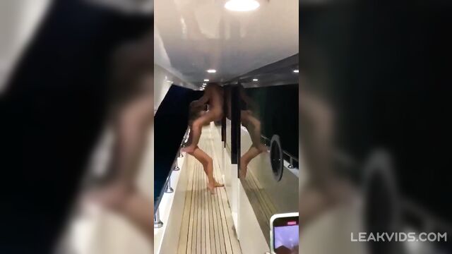 Young prostitute with a beautiful body gives a public blowjob to a rich man at a party on a yacht - 2 image