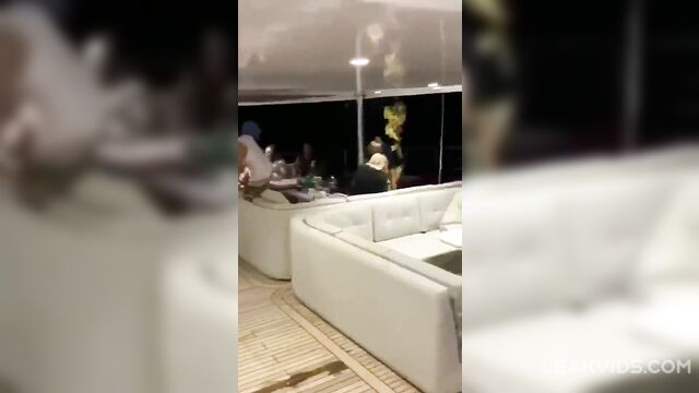 Young prostitute with a beautiful body gives a public blowjob to a rich man at a party on a yacht - 3 image