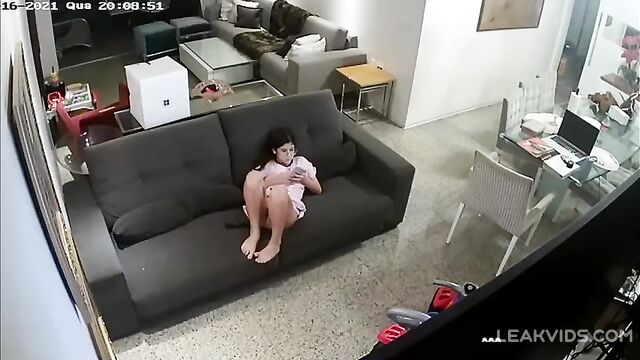 Slutty Italian Daughter Watches Porn and Masturbates on the Couch Caught on Hidden Camera - 1 image